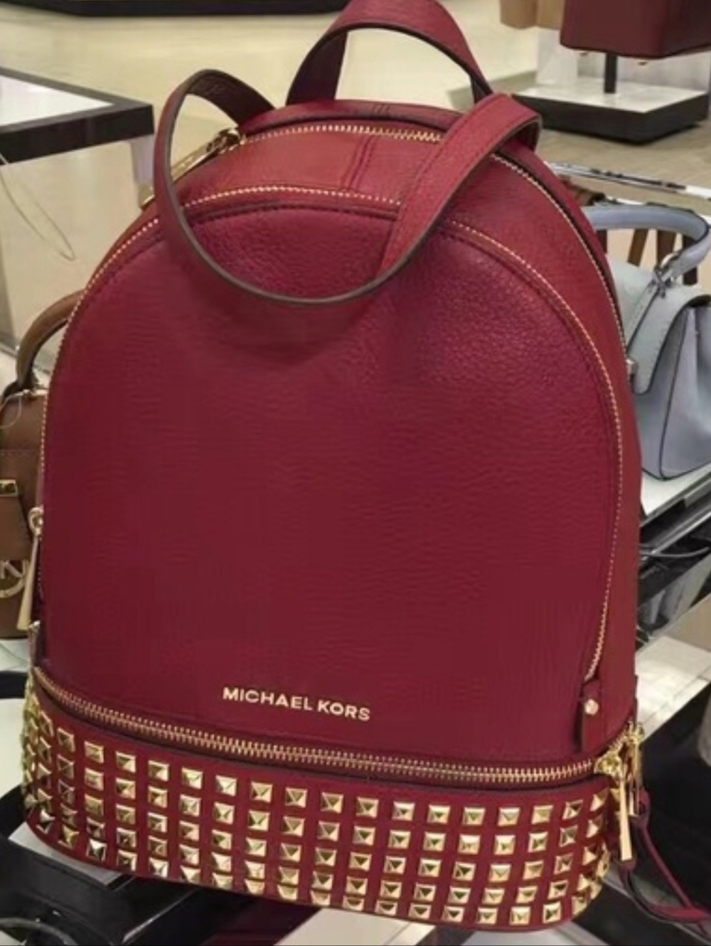 Michael Kors Rhea Studded Backpack In Pebbled Red Leather.